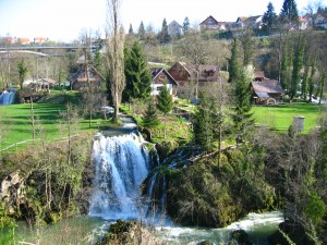 Slunj,_Rastoke,_waterfalls_falling_into_Korana_river